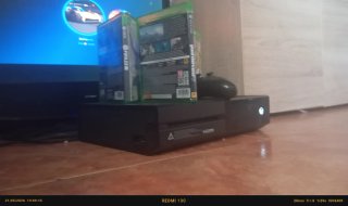 Xbox One con juegos y mando