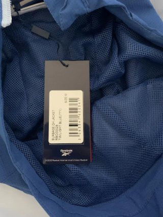 Cortavientos Reebok Azul y Blanco