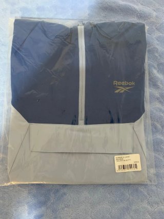 Cortavientos Reebok Azul y Blanco