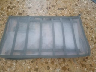 Caja organizadora flexible gris y transparente