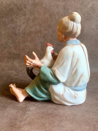 PAREJA DE ANCIANOS JAPONESES EN PORCELANA.