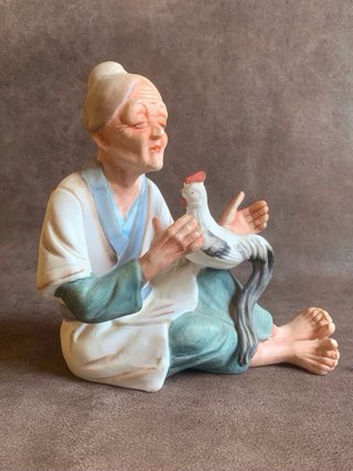 PAREJA DE ANCIANOS JAPONESES EN PORCELANA.