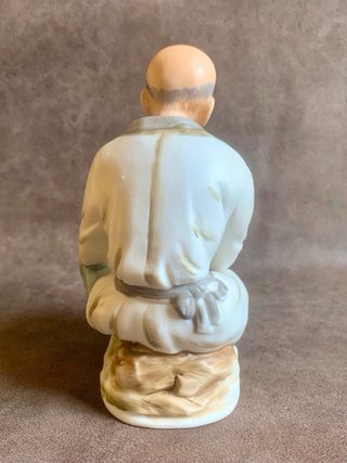 PAREJA DE ANCIANOS JAPONESES EN PORCELANA.