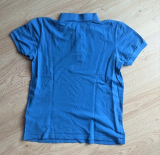 Polo Adidas azul con logo vintage