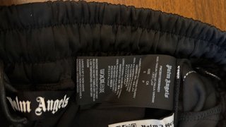 Pantaloncini Palm Angels neri con strisce arcobale