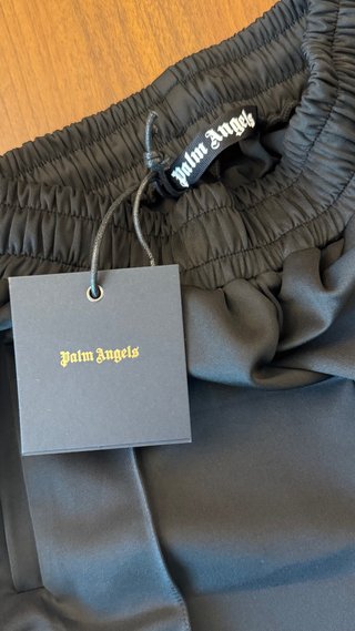 Pantaloncini Palm Angels neri con strisce arcobale