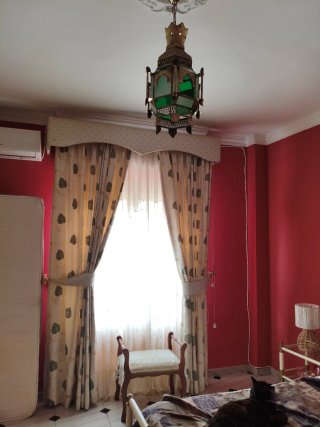Dormitorio de matrimonio de forja blanca y bronce