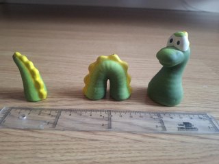 Figuras de cerámica de monstruo de lago