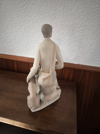 Figura de porcelana: cazador con perro