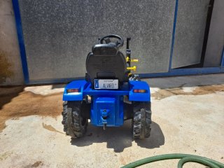 Tractor infantil a pedales con pala