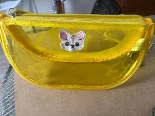 Bolso transparente amarillo con dibujo