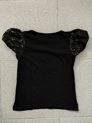 Blusa negra mujer lentejuelas mangas abullonadas.