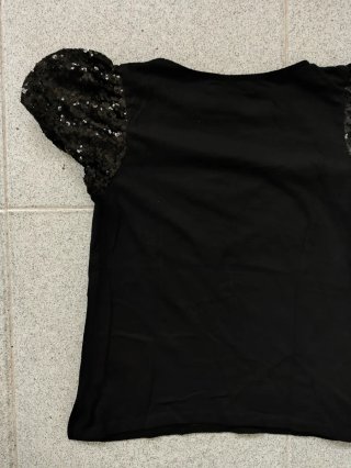 Blusa negra mujer lentejuelas mangas abullonadas.