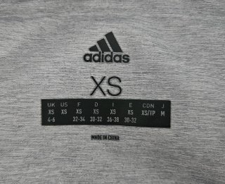 Chaqueta Adidas gris acolchada con capucha