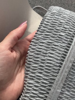 Funda sofa gris.