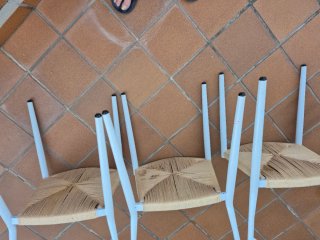 4 Sillones de metal con asiento de cuerda