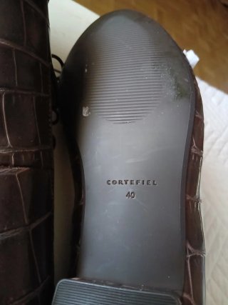 Zapatos planos marrones con lazo