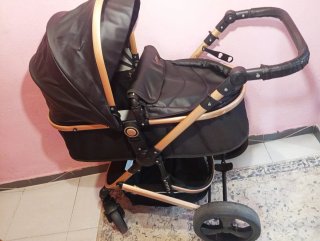 Passeggino per neonati nero e dorato