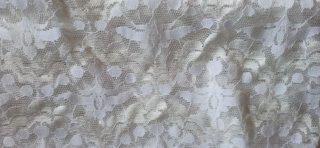 Tela de encaje para cortinas beige y blanco