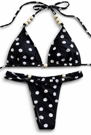 Traje de baño lunares negro,blanco con mini falda