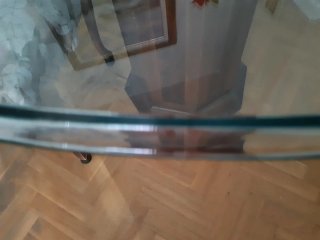 Mesa redonda de cristal y madera para salón