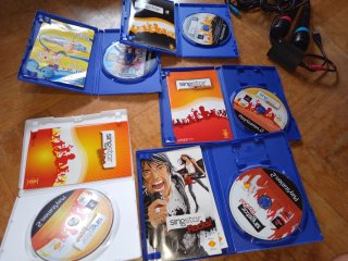 Micrófonos SingStar + 5 Juegos Karaoke PS2