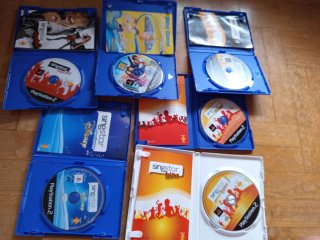 Micrófonos SingStar +  6 Juegos Karaoke PS2