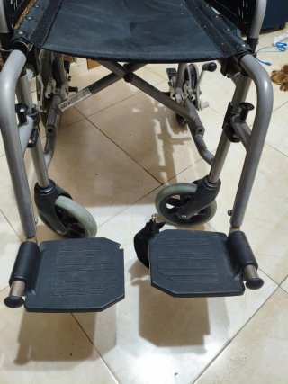 Silla de ruedas (con defecto)