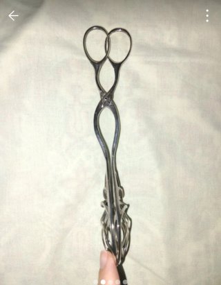 Pinzas de plata con diseño calado