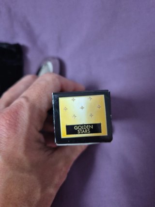 Guerlain tapón pintalabios negro y dorado