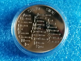 Moneda con Código Morse