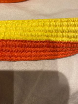 Cinturón Taekwondo IKARA 245cm Naranja/Amarillo