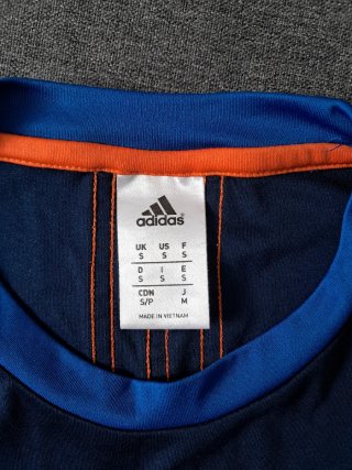Camiseta Adidas Barricade azu oscuro naranja