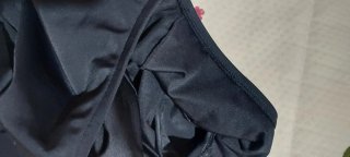 Bañador negro con detalle fruncido, de efecto faja