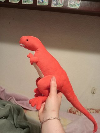 Dinosaurio de peluche hecho a mano
