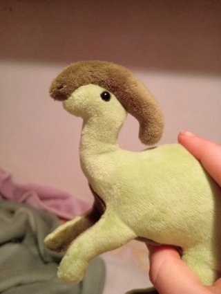 Dinosaurio de peluche hecho a mano