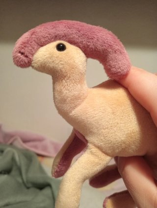 Dinosaurio de peluche hecho a mano