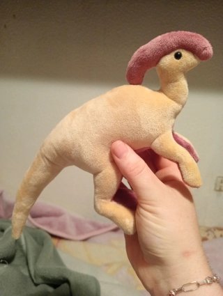 Dinosaurio de peluche hecho a mano