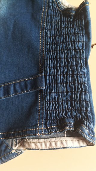 Chaleco vaquero azul con hebilla