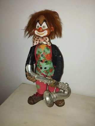 Muñeco antiguo payaso con saxofón