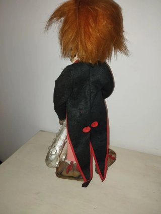 Muñeco antiguo payaso con saxofón