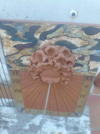 Reloj de Sol Cerámica Cara Niño