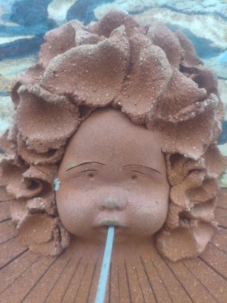 Reloj de Sol Cerámica Cara Niño
