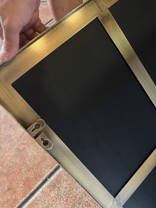 Specchio moderno in metallo e vetro