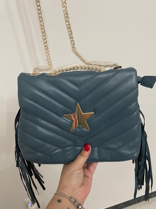 Bolso azul con estrella y flecos