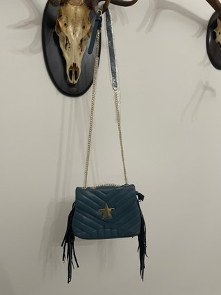 Bolso azul con estrella y flecos
