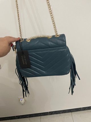 Bolso azul con estrella y flecos