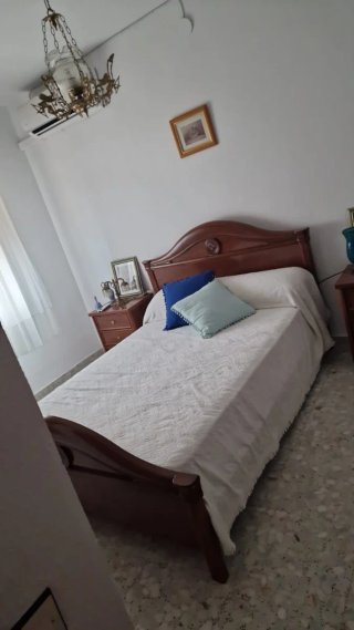Dormitorio madera oscura