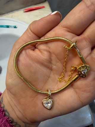 Pulsera dorada charms