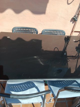 Mesa cristal y hierro con 4 sillas